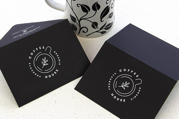Restaurant branding - white printing on black cards and envelopes for coffee shop gift card holders