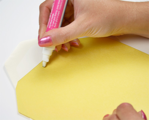Glue envelope liner into envelope with a small amount of glue