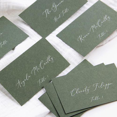 Dusty green wedding place cards printed in white by LCI Paper