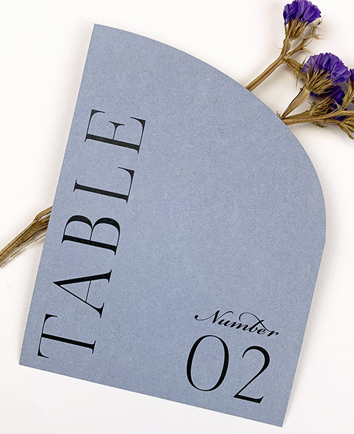 Simple modern half-arch table number card printed by LCI Paper on dusty blue half-arch cards