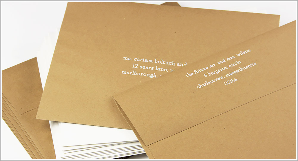 White addressing on Grocer Kraft envelopes in lowercase Lifesavers font