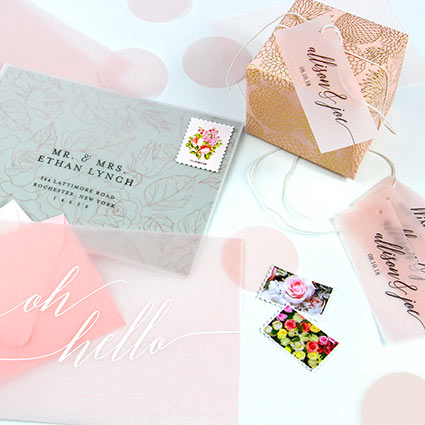 Pink vellum paper used as invitation overlay, favor tag, place cards, confetti