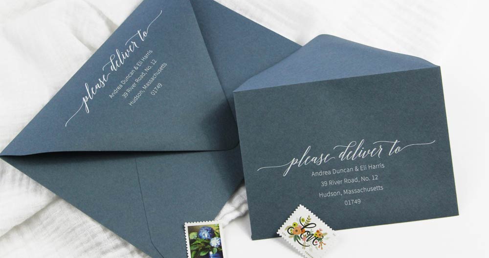 Dusty blue envelopes printed with white ink. Download free wedding return address template from LCI Paper. Customize and print in black at home or order printed in white from LCI Paper