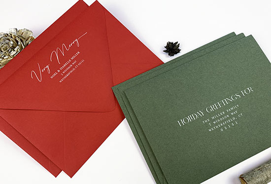 Red and green Christmas card envelopes, printed in white by LCI Paper