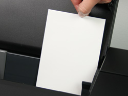 loading rsvp-wedding response envelopes into printer