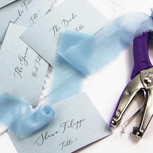Dusty blue flat place cards with ribbon. Free word template, instructions, cardstock from LCI Paper