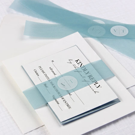 Wedding invitation with translucent vellum band printed in white. Subtle vellum bands and wraps a stylish way to organize wedding invitations.