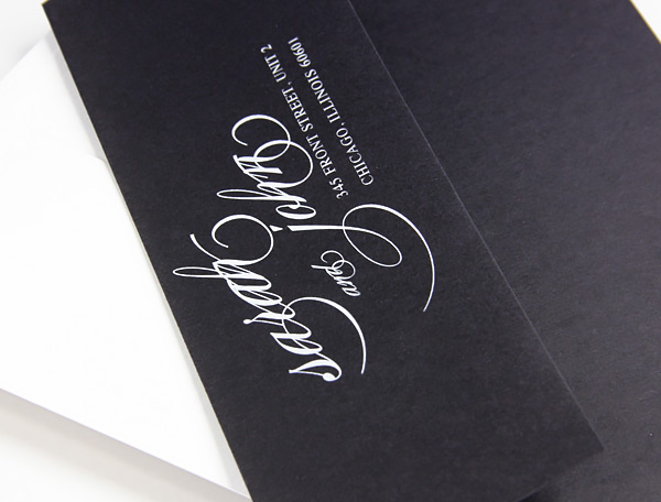 white printing on black envelopes