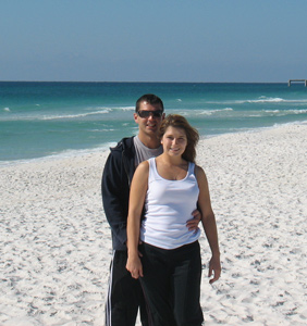 Melissa and fiancé at their beach wedding site