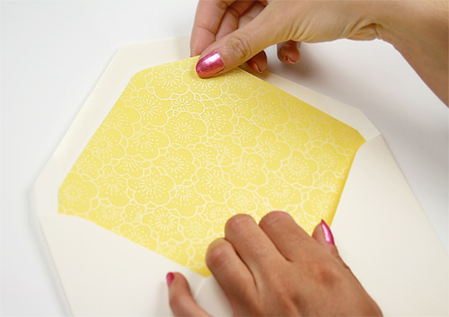 Adjust envelope liner so it sits below the gum seal and evenly inside of the flap