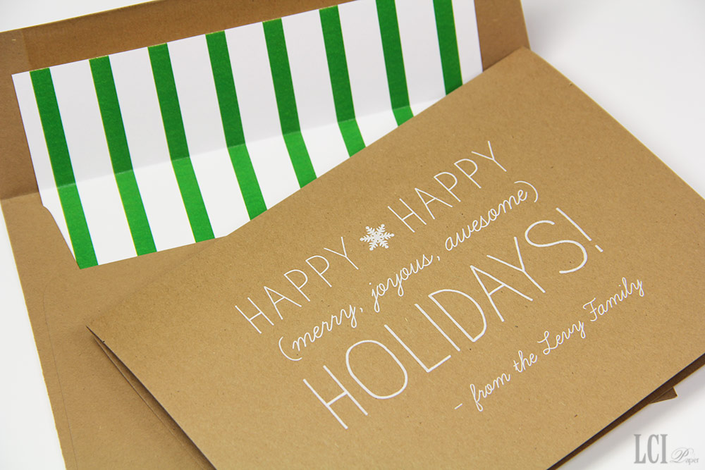 kraft and white holiday card with kelly green and white striped envelope liner