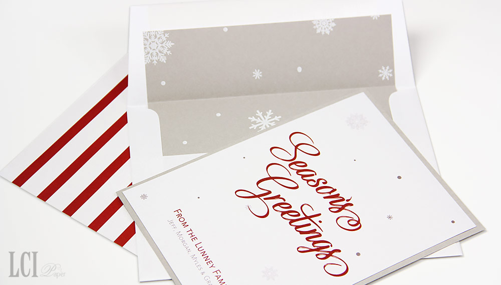 Red white and gray holiday card with matching snowflake envelope liner