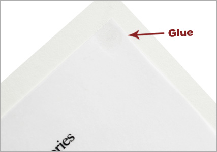 clear vellum adhered to an ecru invitation card with glue